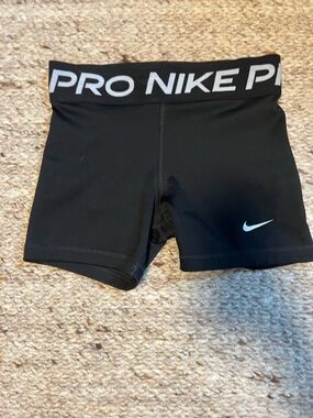 Nike Black Compression Shorts with White Swoosh Accent